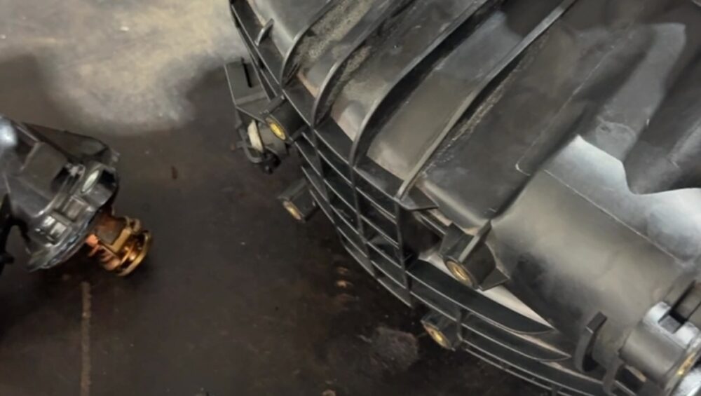 Jeep Grand Cherokee V6 diesel intake manifold, swirl actuator and coolant hoses on the bench