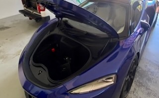 McLaren front compartment open for a mobile battery replacement