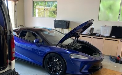 Blue McLaren in a Gold Coast home garage with the front bonnet raised